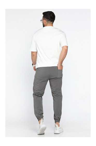  نشان‌های شلوار پارچه ای جاگر شمعی Elastane Slim Fit ممکن است متفاوت باشد مردانه خاکی روشن ال سی وایکیکی 